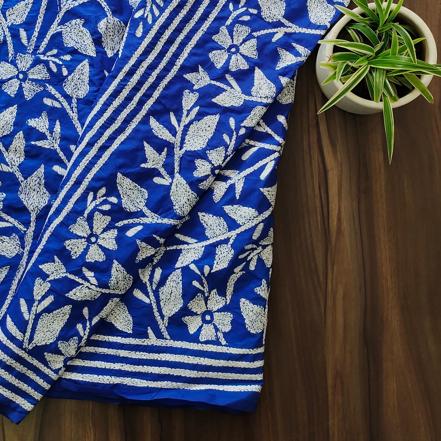 Regal Blooms: Royal Blue Kantha Saree with White Floral Embroidery